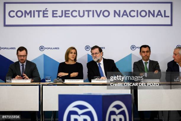 Spanish Prime Minister Mariano Rajoy and her Spanish Minister of Defence Maria Doroles de Cospedal attend a Popular Party meeting of the national...