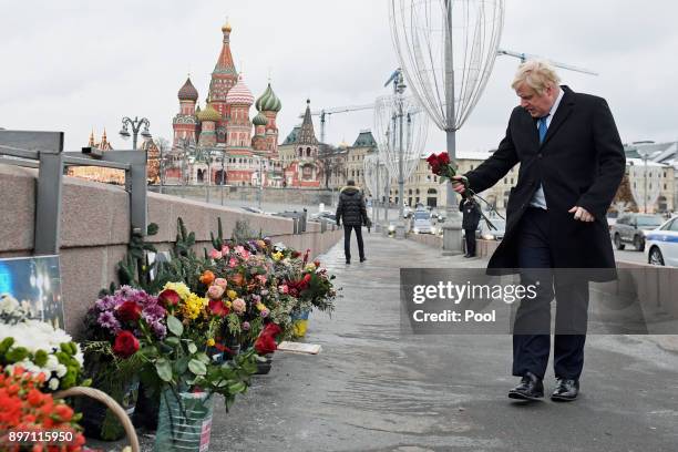 British Foreign Secretary Boris Johnsonlays a floral tribute at the site where opposition leader Boris Nemtsov was fatally shot on a bridge near Red...