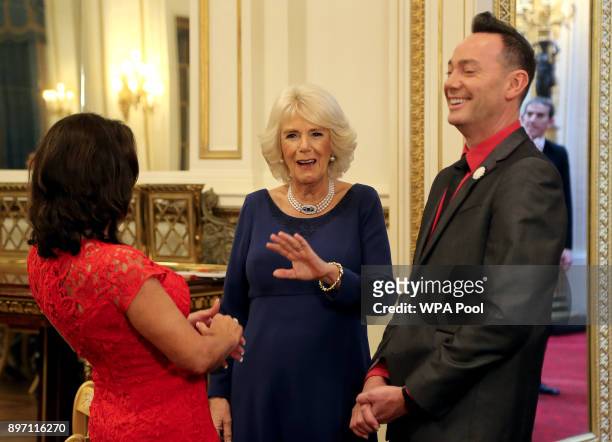 Camilla, Duchess of Cornwall, President of the National Osteoporosis Society, talks to 'Strictly Come Dancing' judges Shirley Ballas and Craig Revel...