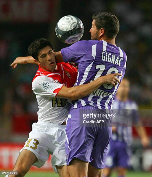 Monaco's defender Vincent Muratori vies with Toulouse's forward Andre-Pierre Gignac during the French L1 football match Monaco vs. Toulouse, on...
