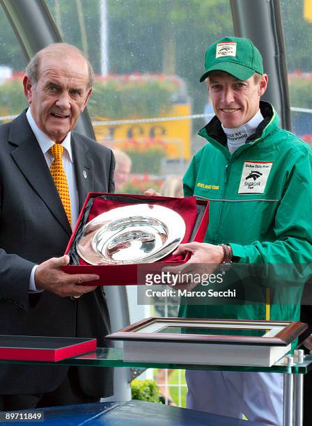 Jockey Richard Hughes of Team Ireland Captain and winner for the second time of the Silver Saddle smiles as he receives his trophy at The Dubai Duty...