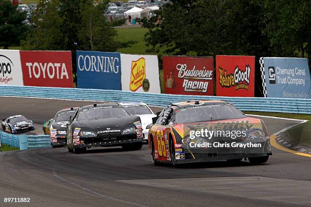 Steve Wallace, driver of the 5-hour Energy Chevrolet, leads a group of cars during the NASCAR Nationwide Series Zippo 200 at Watkins Glen...