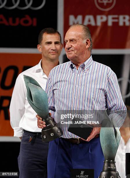 Spain's King Juan Carlos and Prince Felipe attend the trophy ceremony for the 28th Copa del Rey regatta at Ses Voltes Park on August 8, 2009 in Palma...