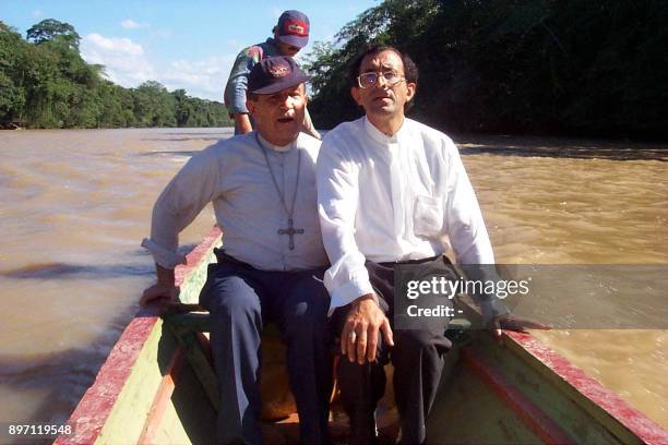 The bishop of Tibu Monsnor, Jose de Jesus Quintero , journeys with a representative of the church, Catatumbo, Colombia, 19 September 1999. El obispo...