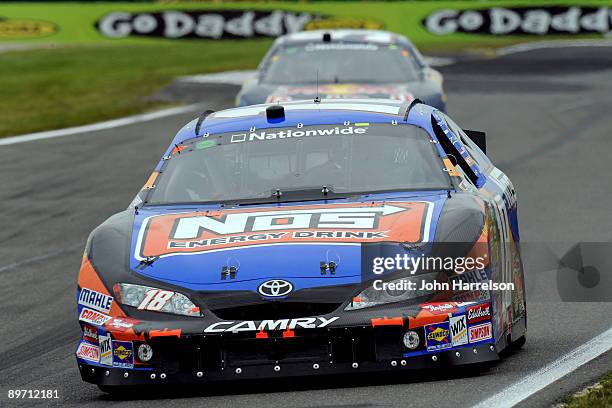 Kyle Busch, driver of the NOS Toyota, leads Scott Speed, driver of the Red Bull Toyota, during the NASCAR Nationwide Series Zippo 200 at Watkins Glen...