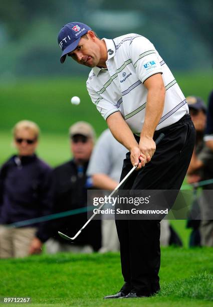 Padraig Harrington of Ireland plays a shot on the 14th hole during the third round of the WGC-Bridgestone Invitational on the South Course at...