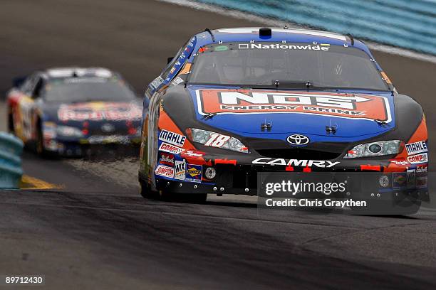 Kyle Busch, driver of the NOS Toyota, leads Scott Speed, driver of the Red Bull Toyota, during the NASCAR Nationwide Series Zippo 200 at Watkins Glen...