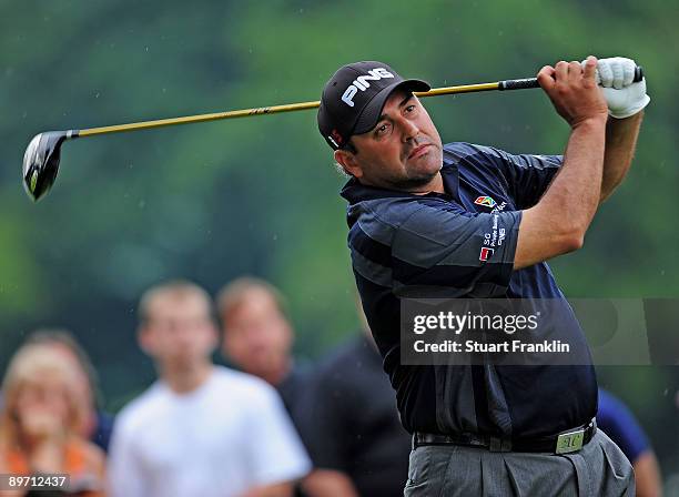 Angel Cabrera of Argentina plays his tee shot on the 11th hole during the third round of the World Golf Championship Bridgestone Invitational on...