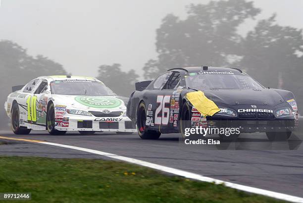 Michael McDowell, driver of the Fisher Honda Dodge, leads Justin Marks, driver of the Construct corps Toyota, during the NASCAR Nationwide Series...