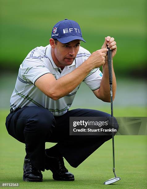 Padraig Harrington of Ireland lines up his putt on the 16th hole during the third round of the World Golf Championship Bridgestone Invitational on...