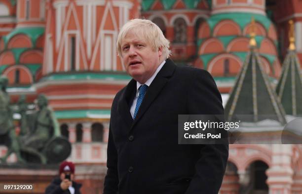 BritishForeign Secretary Boris Johnson stands in front of St Basil's Cathedral during a visit to Red Square on December 22, 2017 in Moscow, Russia....