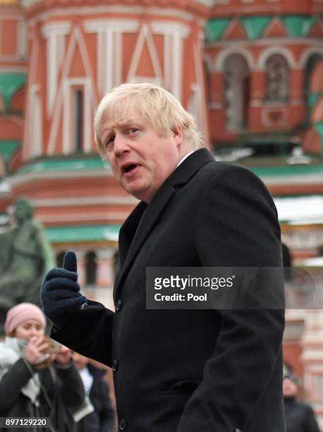 BritishForeign Secretary Boris Johnson stands in front of St Basil's Cathedral during a visit to Red Square on December 22, 2017 in Moscow, Russia....