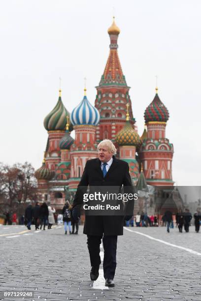 BritishForeign Secretary Boris Johnson stands in front of St Basil's Cathedral during a visit to Red Square on December 22, 2017 in Moscow, Russia....