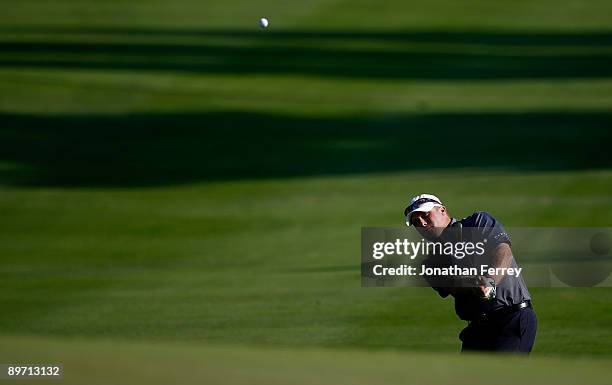 John Rollins hits his third shot on the 17th hole during the third round of the Legends Reno-Tahoe Open on August 8, 2009 at Montreux Golf and...