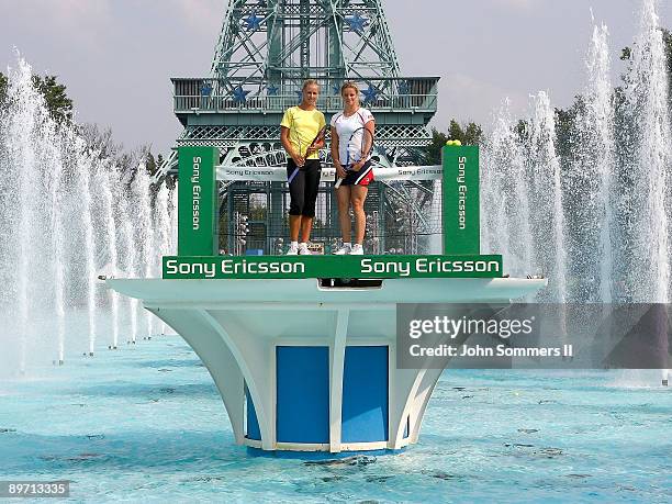Elena Dementieva of Russia and Kim Clijsters of Belgium pose before a match on top of a Fountain at Kings Island before the start of the Wester &...
