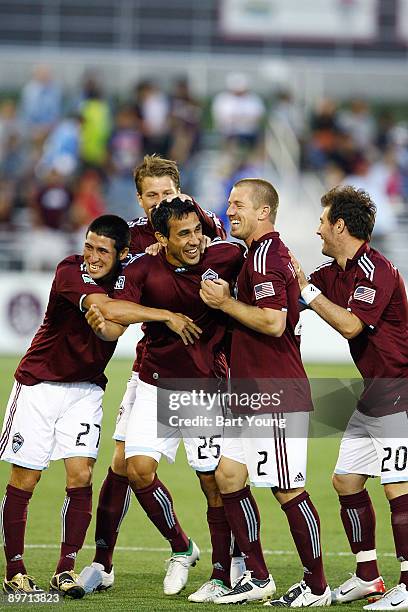 August 8: Pablo Mastroeni celebrates his goal with teammates Jamie Smith, Jordan Harvey and Kosuke Kimura of the Colorado Rapids against the Chivas...