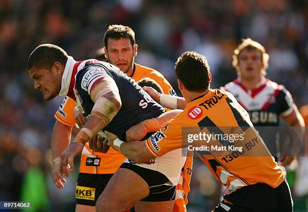 Willie Mason of the Roosters charges forward during the round 22 NRL match between the Sydney Roosters and the Wests Tigers at the Sydney Football...