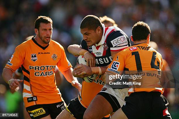 Willie Mason of the Roosters charges forward during the round 22 NRL match between the Sydney Roosters and the Wests Tigers at the Sydney Football...