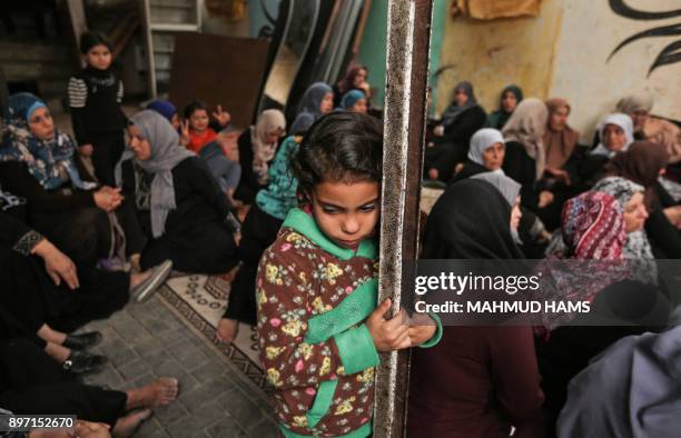 Relatives of Zakaria al-Kafarneh, who was killed during clashes with Israeli troops, mourn during his funeral in Beit Hanoun in the northern Gaza...