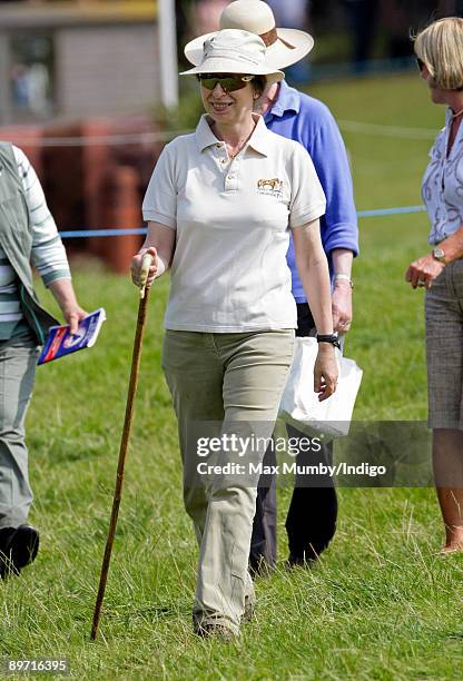 Princess Anne, The Princess Royal uses a walking stick as she strolls around The Festival of British Eventing held on her country estate at Gatcombe...