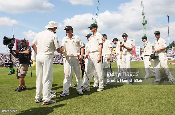 Marcus North of Australia walks off with team mates after Australia defeated England during day three of the npower 4th Ashes Test Match between...