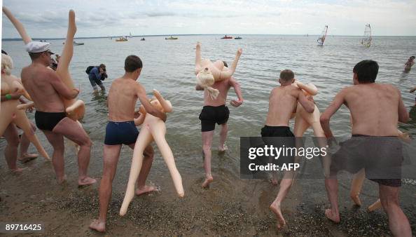Men get ready to start a funny swimming Men get ready to start a funny swimming