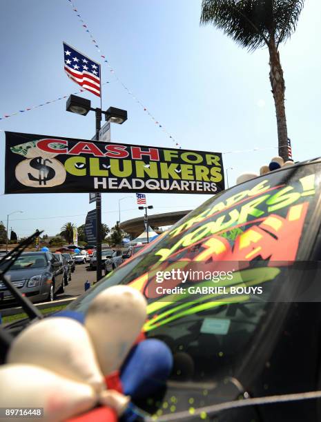 By Rob Lever, US-economy-auto-politics A Ford car dealer in Marina del Rey, California, offers the "Cash for Clunkers" program to customers on August...