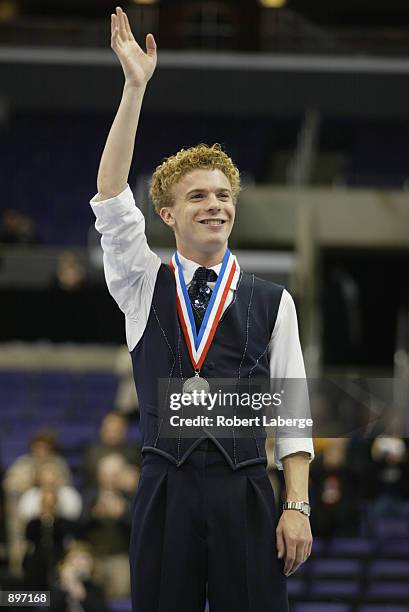 Timothy Goebel stands on the podium with his silver medal after the men's long program State Farm US Figure Skating Championships on January 10, 2002...