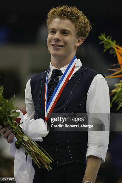 Timothy Goebel stands on the podium with his silver medal after the men's long program State Farm US Figure Skating Championships on January 10, 2002...