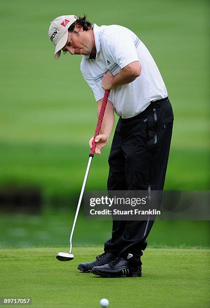 Tim Clark of South Africa putting on the 16th hole where he was penalised with a two shot penalty after not replaceing his ball in the original spot...