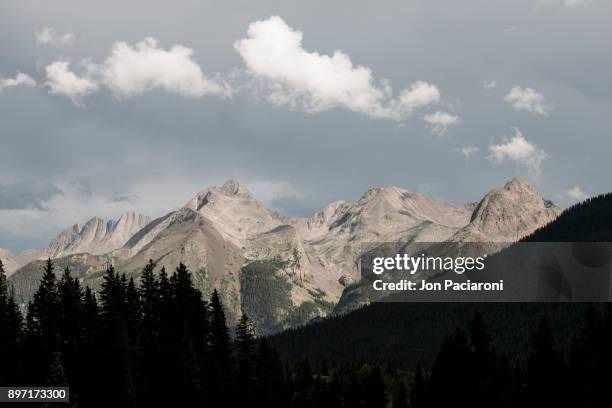 clouds moving the grenadier range in the san juan mountains in summer - san juan mountains stockfoto's en -beelden