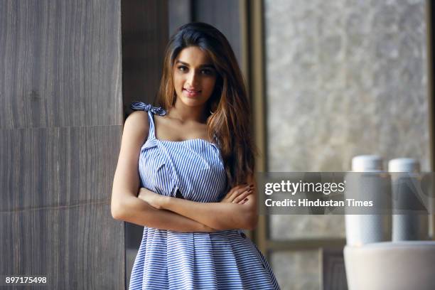 Bollywood actress Nidhhi Agerwal poses for a profile shoot at Roseate House Hotel on July 18, 2017 in New Delhi, India.