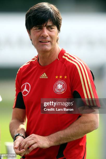 Headcoach Joachim Loew cools his finger after a insect bite during the German National Team training session at the Kleine Kampfbahn on August 9,...