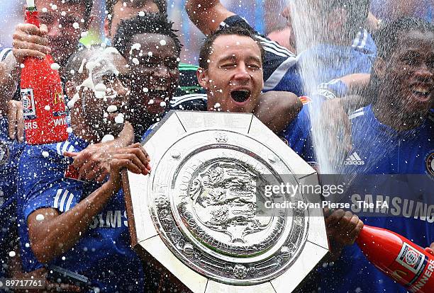 John Terry of Chelsea celebrates with the Community Shield after the FA Community Shield match between Manchester United and Chelsea at Wembley...
