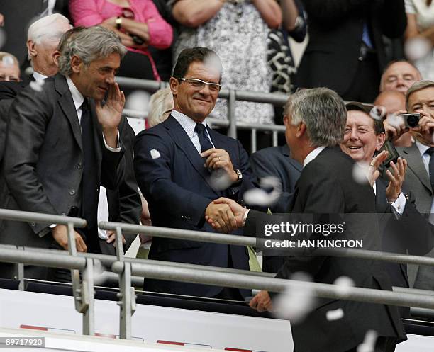 Chelsea's Italian Manager Carlo Ancelotti shakes hands with England Manager Fabio Capello , after the final whistle during the FA Community Shield at...