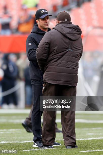 Head coach Hue Jackson of the Cleveland Browns talks with Head coach John Harbaugh of the Baltimore Ravens prior to the start of the game at...