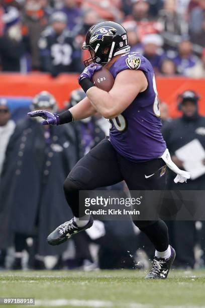 Nick Boyle of the Baltimore Ravens carries the ball during the game against the Cleveland Browns at FirstEnergy Stadium on December 17, 2017 in...