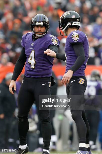 Sam Koch of the Baltimore Ravens congratulates Justin Tucker of the Baltimore Ravens after kicking a field goal during the game against the Cleveland...