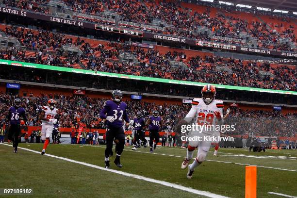 Duke Johnson Jr. #29 of the Cleveland Browns out runs Eric Weddle of the Baltimore Ravens to score a touchdown during the game at FirstEnergy Stadium...