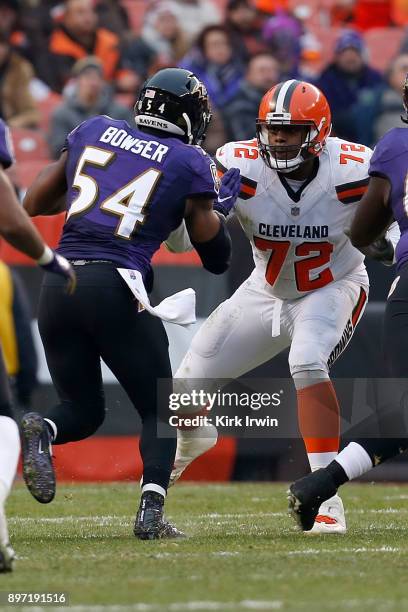 Shon Coleman of the Cleveland Browns defends against Tyus Bowser of the Baltimore Ravens during the game at FirstEnergy Stadium on December 17, 2017...