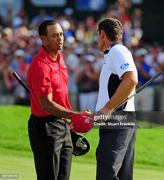 Tiger Woods of USA is congratulated by Padraig Harrington of Ireland on the 18th hole during the final round of the World Golf Championship...