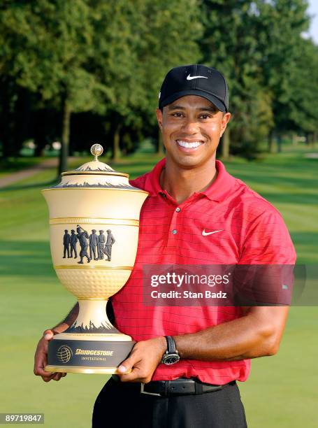 Tiger Woods holds the Bridgestone Invitational Champions trophy after winning the final round of the World Golf Championships-Bridgestone...