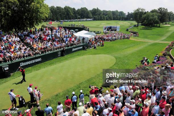 Tiger Woods of USA plays his tee shot on the first hole during the final round of the World Golf Championship Bridgestone Invitational on August 9,...