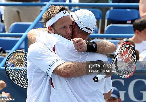 Martin Damm of the Czech Republic and Robert Lindstedt of Sweden celebrate after defeating Mariusz Fyrstenberg and Marcin Matkowski, both of Poland,...