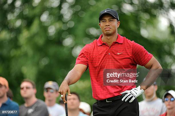Tiger Woods waits for play at the 11th tee box during the final round of the World Golf Championships-Bridgestone Invitational held at Firestone...