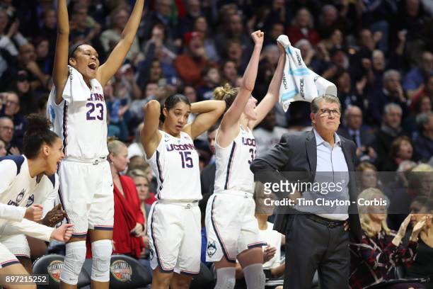 Head coach Geno Auriemma of the UConn Huskies on the sideline while recording his 1000th win as head coach of the team as the bench of Azura Stevens...