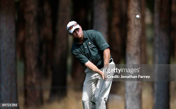 John Rollins chips on the 4th hole during the final round of the Legends Reno-Tahoe Open on August 9, 2009 at Montreux Golf and Country Club in Reno,...