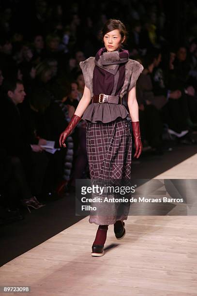 Model walks the runway at the Kenzo Ready-to-Wear A/W 2009 fashion show during Paris Fashion Week at Carreau du Temple on March 11, 2009 in Paris,...