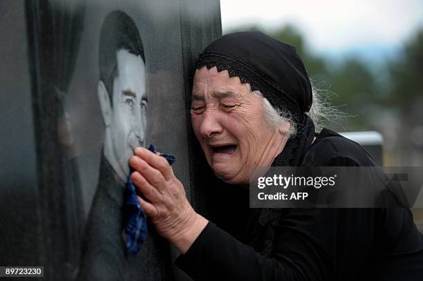 South Ossetian woman expresses her grief beside the grave of her son killed in the August 2008 conflict, in Tskhinvali on August 9, 2009. Georgia and...