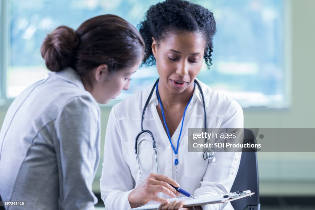 Doctor reviews a patient's medical information